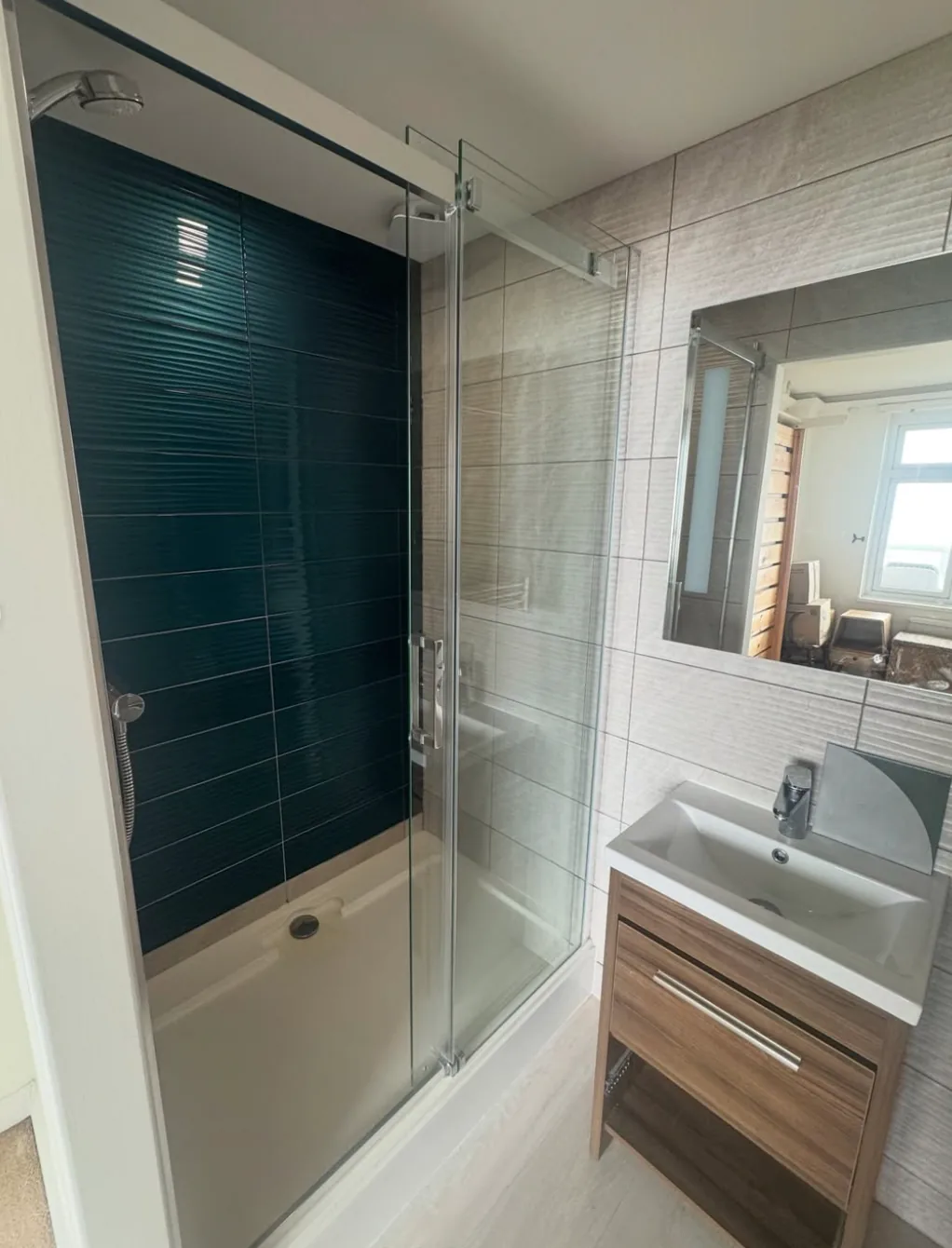 Completed shower enclosure and bathroom tiling by Infinite Plumbing & Heating