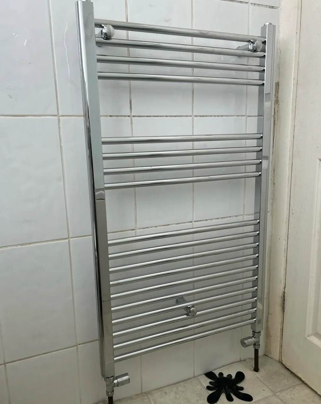 Chrome heated towel radiator fitted by Infinite Plumbing & Heating