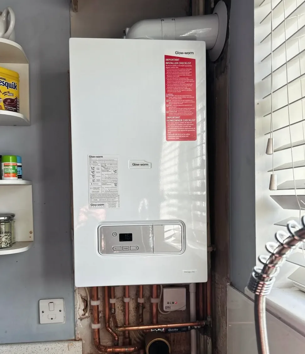 Glow-worm boiler installation with exposed copper pipework by Infinite Plumbing & Heating