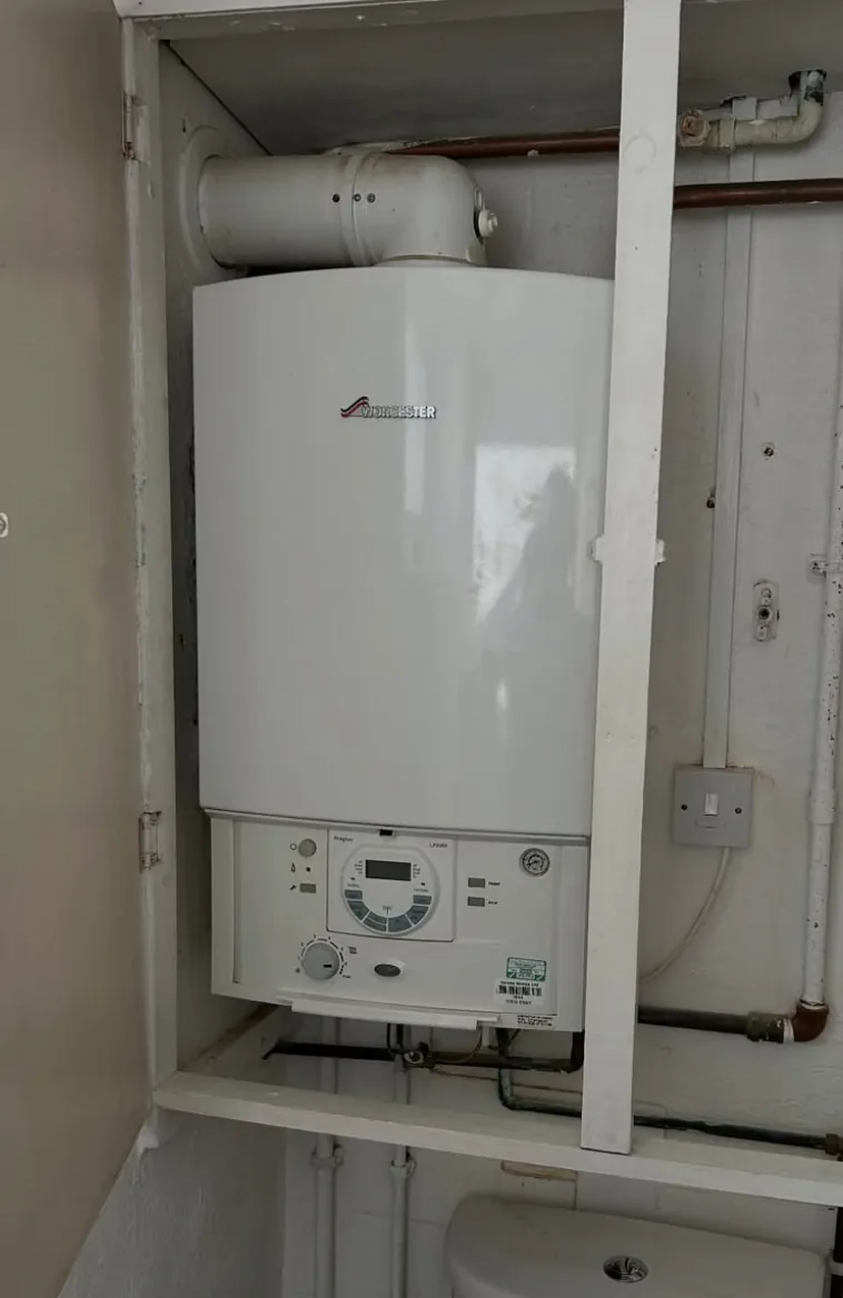 Worcester boiler installation in a cupboard by Infinite Plumbing & Heating
